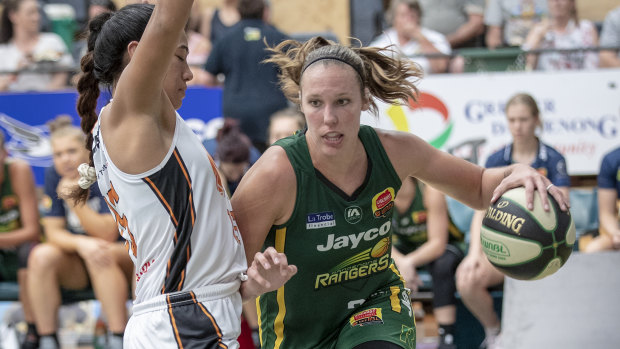 baseline drive: Ranger Kayla Pederson finds her way around rising Townsville star Zitina Aokuso. 