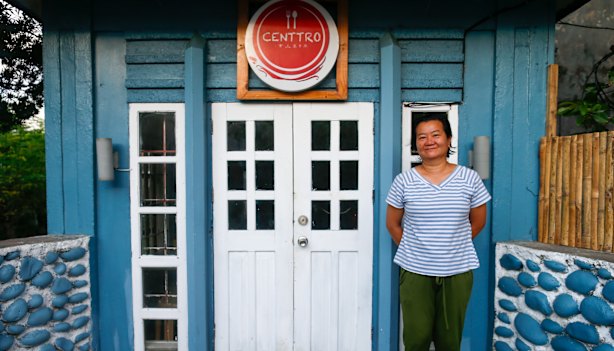 Jeanette “Jinky” Cabardo in front of her cafe in Basco.