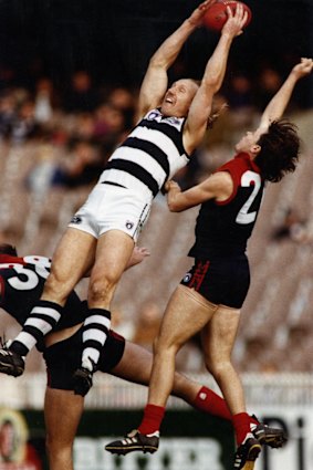 Gary Ablett leaps for a mark.