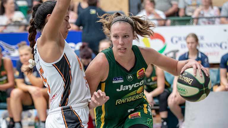 baseline drive: Ranger Kayla Pederson finds her way around rising Townsville star Zitina Aokuso. 