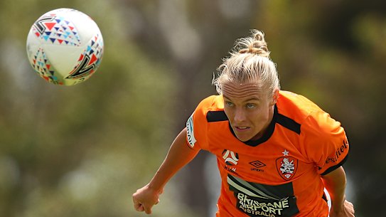 Brisbane's Tameka Yallop heads the ball.