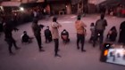 A screenshot from a video posted by Reuters that purported to show Hamas fighters executing men alleged to be Israeli collaborators on a Gaza City street.