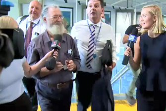 Mr Potter in custody at Cairns Airport.
