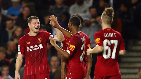 James Milner (left) led the way for a young Liverpool side.