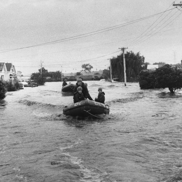 Army dinghies patrol Navigator Street in Maribyrnong during the 1974 flood.