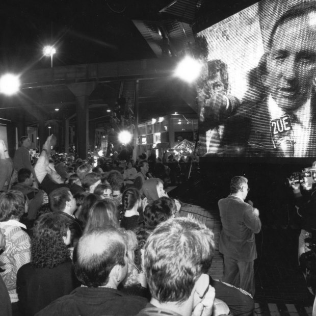 Prime Minister Paul Keating is on the big screen as Sydneysiders celebrate at Circular Quay.