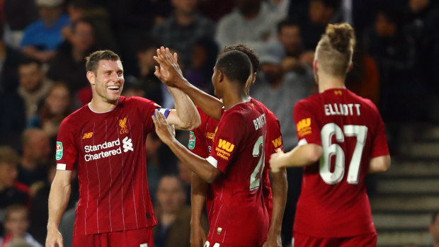 James Milner (left) led the way for a young Liverpool side.