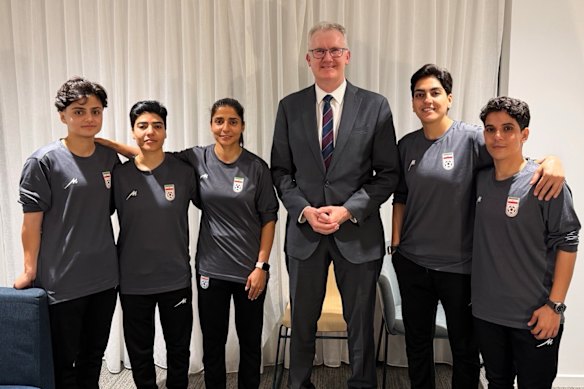 Minister for Home Affairs Tony Burke with five Iranian women soccer players who were granted asylum in Australia on Monday night.