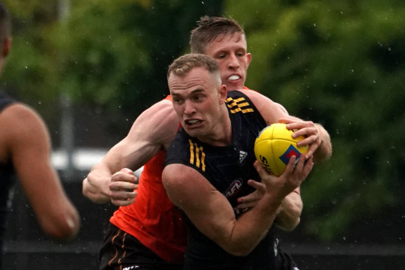Tom Mitchell under pressure at Tuesday's practice match. 