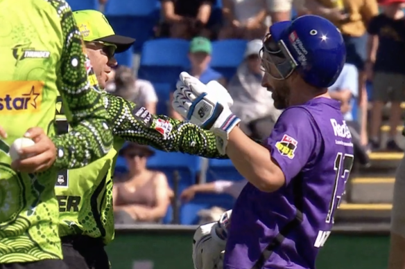 David Warner shoves Matthew Wade during Sunday’s Big Bash match.