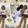 Tharnicaa and her sister Kopika in hospital on Christmas Island on June 6.