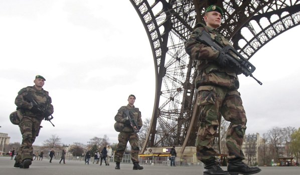 French soldiers patrol in front of the Eiffel Tower after the Charlie Hebdo attack.