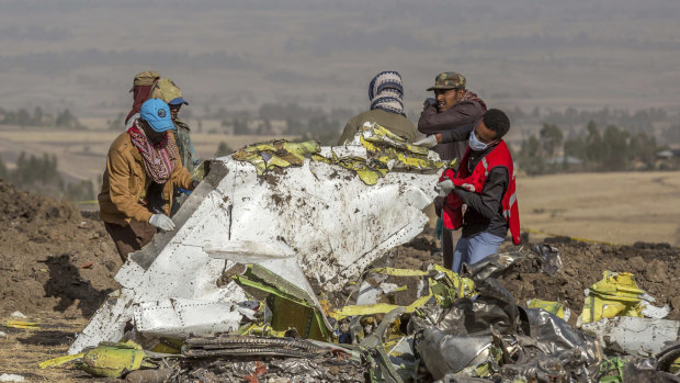 Rescue workers comb the scene of the Ethiopian Airlines crash.