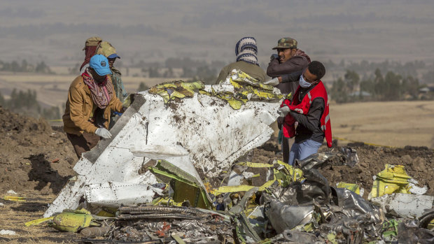 Rescue workers comb the scene of the Ethiopian Airlines crash. Nearly half of the airline deaths in 2018 and 2019 occurred during the two Boeing 737 Max crashes in Indonesia and Ethiopia.