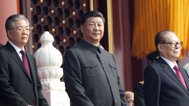 Chinese President Xi Jinping, centre, with former presidents Jiang Zemin, right, and Hu Jintao, left.