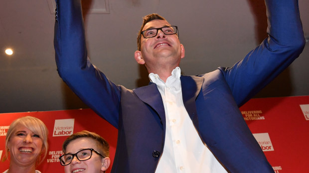 The Premier celebrates victory after his re-election.