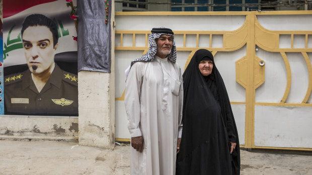Abid al-Sudani with his wife, Laisa Hashim Shuaith, the parents of Captain Harith al-Sudani, outside their home in Baghdad, on May 8.