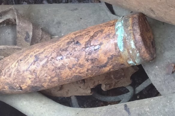 Scrap metal and an old cannon shell on a Chinese-registered vessel after it was detained in the waters of east Johor.