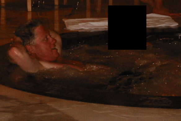 Clinton in a hot tub with an unidentified woman.