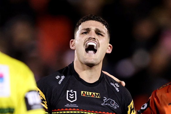 A frustrated Nathan Cleary is assisted from the field by Penrith chief physio Pete Green.