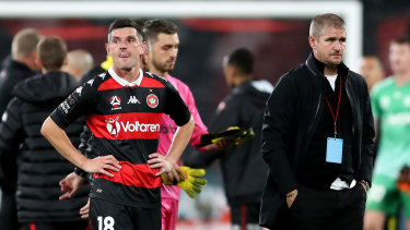 Wanderers coach Carl Robinson and Graham Dorrans react at full-time after losing to the Phoenix at Bankwest Stadium.