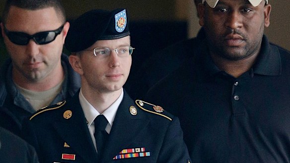 Army PFC, formerly Bradley Manning, is escorted to a security vehicle after his court martial for leaking classified material to WikiLeaks. 