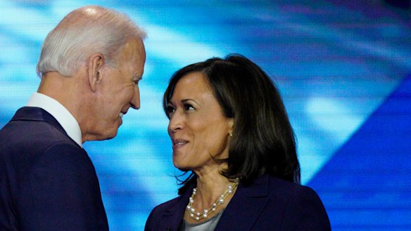 Joe Biden and Kamala Harris shake hands after a Democratic presidential primary debate in September last year.