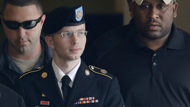 Army PFC, formerly Bradley Manning, is escorted to a security vehicle after his court martial for leaking classified material to WikiLeaks. 