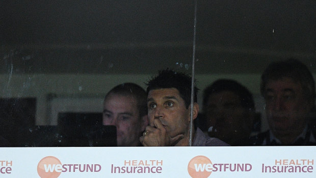Car crash in motion: Sea Eagles coach Trent Barrett looks on from the coaching box as his side go down to the Titans.