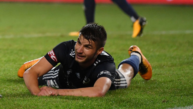 A crying game: Terry Antonis lies on the ground after conceding an own goal to send the semi-final into extra time.