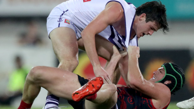 Brotherly shove: Andrew (top) and Angus Brayshaw go at it when their respective teams met in round 16.