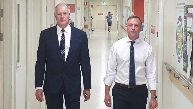 Queensland Health Director-General John Wakefield (left), pictured with Queensland Health Minister Steven Miles, said "none of these practices are perfect".