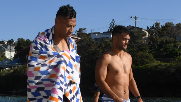 Folau and Hunt at a Waratahs recovery session in February at Clovelly Beach. 