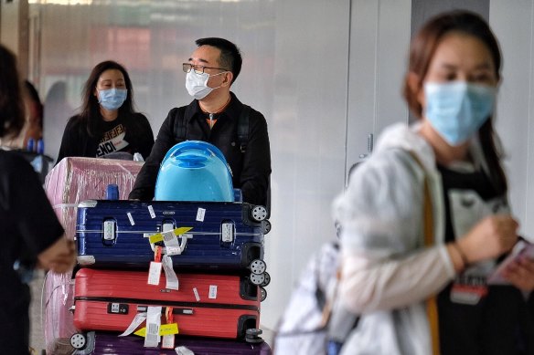 Passengers wearing masks at Melbourne Airport.