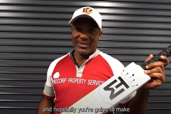 West Indies great Brian Lara holding a Tazwin Sports bat.