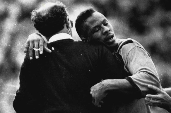 Ellery Hanley is assisted from the field after being tackled by Terry Lamb during the 1988 grand final.