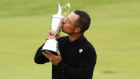 Xander Schauffele kisses the Claret Jug on the 18th green on Sunday.