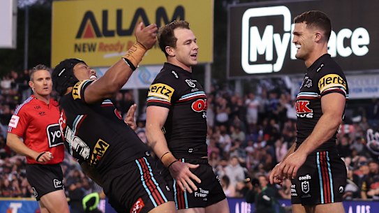 Nathan Cleary (right) celebrates after his late try.