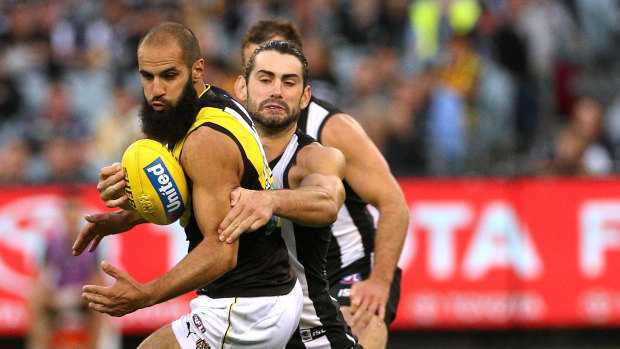 Richmond's Bachar Houli is tackled by Brodie Grundy last weekend.