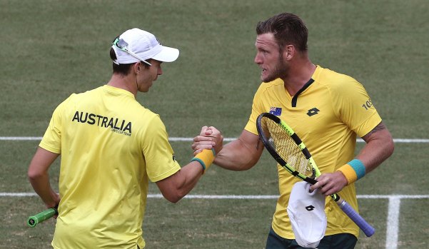 Australia’s Sam Groth, right, celebrates a Davis Cup doubles win with John Peers in Sydney.
