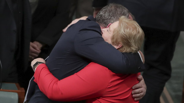 Liberal MP Ann Sudmalis is embraced by colleague Barnaby Joyce after speaking during the adjournment debate in the House of Representatives at Parliament House on  Monday.