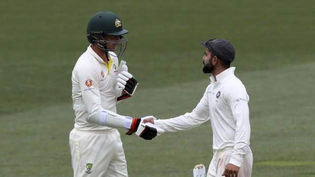 Fine contest: Kohli is congratulated by Josh Hazlewood after the final wicket fell.