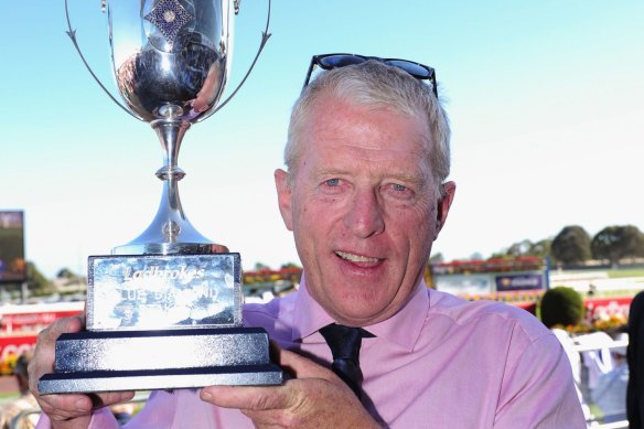 Mick Price, posing with the Blue Diamond Stakes trophy in 2016 after Extreme Choice’s win.