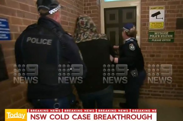 Mr Rumsby being escorted into Mudgee police station on Tuesday night.