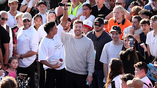 SYDNEY, AUSTRALIA - JUNE 26: Mr Beast, a.k.a Jimmy Donaldson performs with members of the crowd during the MrBeast Feastables launch at Sydney Opera House on June 26, 2024 in Sydney, Australia. (Photo by Brendon Thorne/Getty Images)