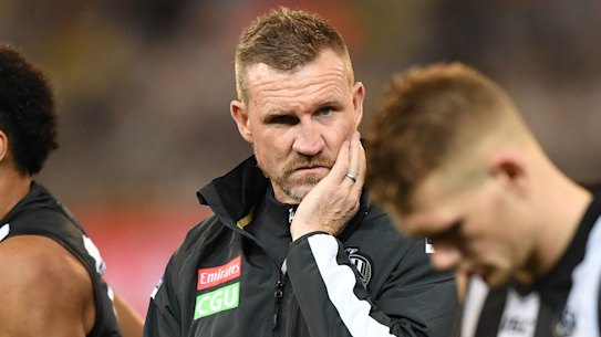 Magpies coach Nathan Buckley (centre) is seen during the Round 19 match between Collingwood and Richmond.