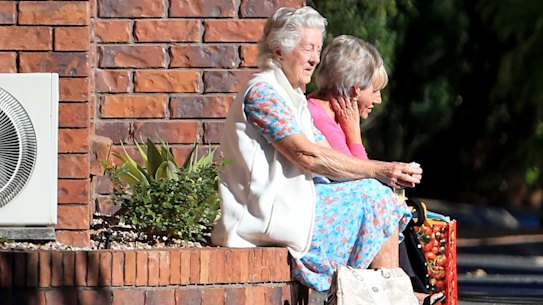 Residents are seen outside the Earle Haven Nursing Home following its shock closure.