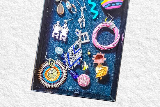 My orphan earrings project an  optimism.