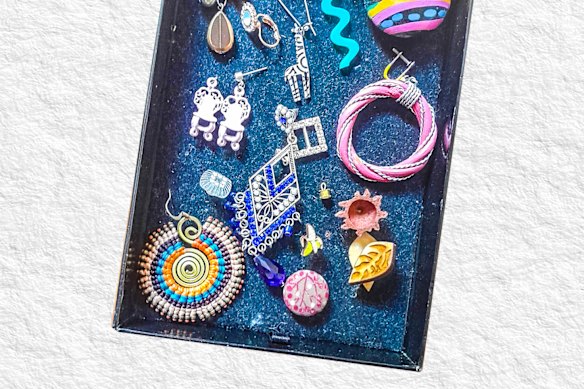 My orphan earrings project an  optimism.