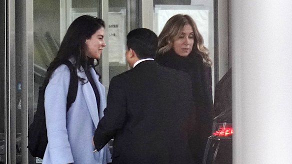Daughter Caroline (left) and wife Carole (right) were on hand to greet Ghosn. 